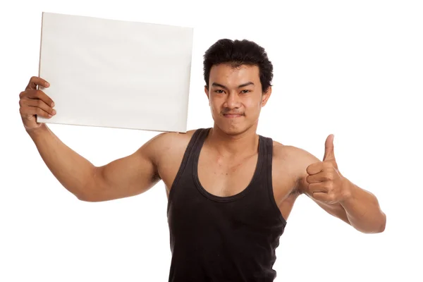 Muscular Asian man thumbs up with blank sign — Stock Photo, Image