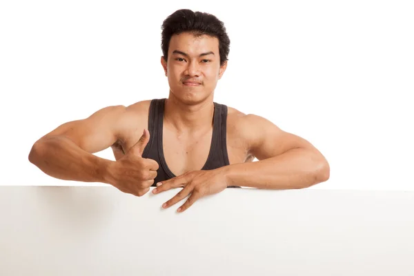 Muscular Asiático homem polegares para cima atrás de sinal em branco — Fotografia de Stock