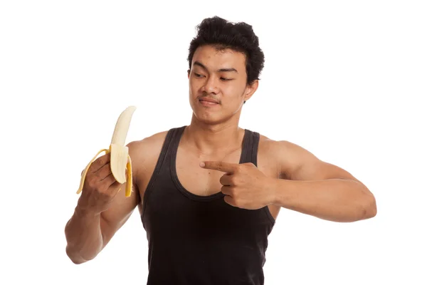 Muscular asiático hombre punto a pelado plátano — Foto de Stock