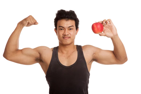 Izmos ázsiai ember flexing bicepsz, piros Alma — Stock Fotó