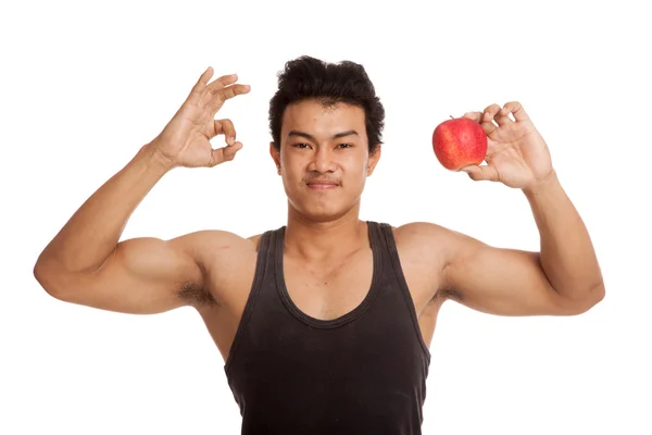 Muscular Asian man show OK with red apple — Stock Photo, Image