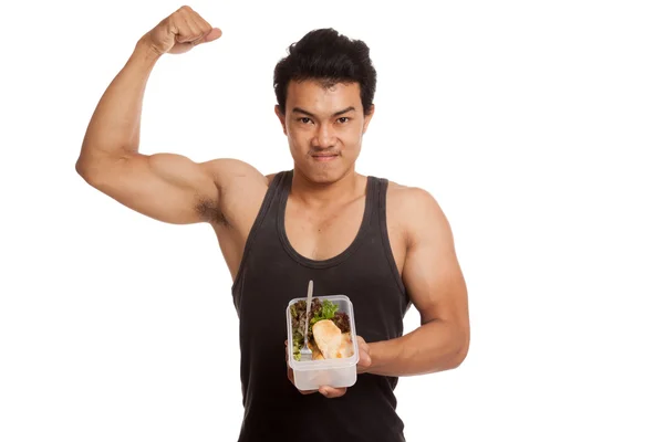 Muscular asiático hombre flexing bíceps con limpio alimentos — Foto de Stock