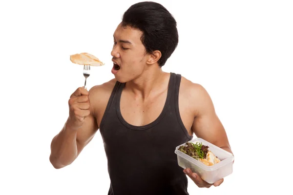 Muscular asiático hombre comer limpio comida en caja — Foto de Stock