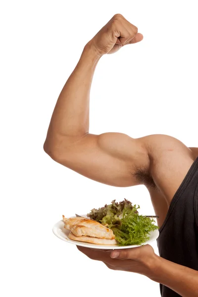Muscular braço do homem asiático flexionando bíceps com comida limpa — Fotografia de Stock