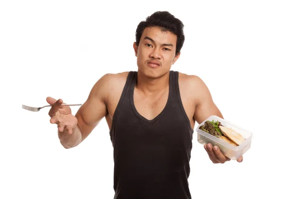 Unhappy muscular Asian man with clean food in box Stock Image