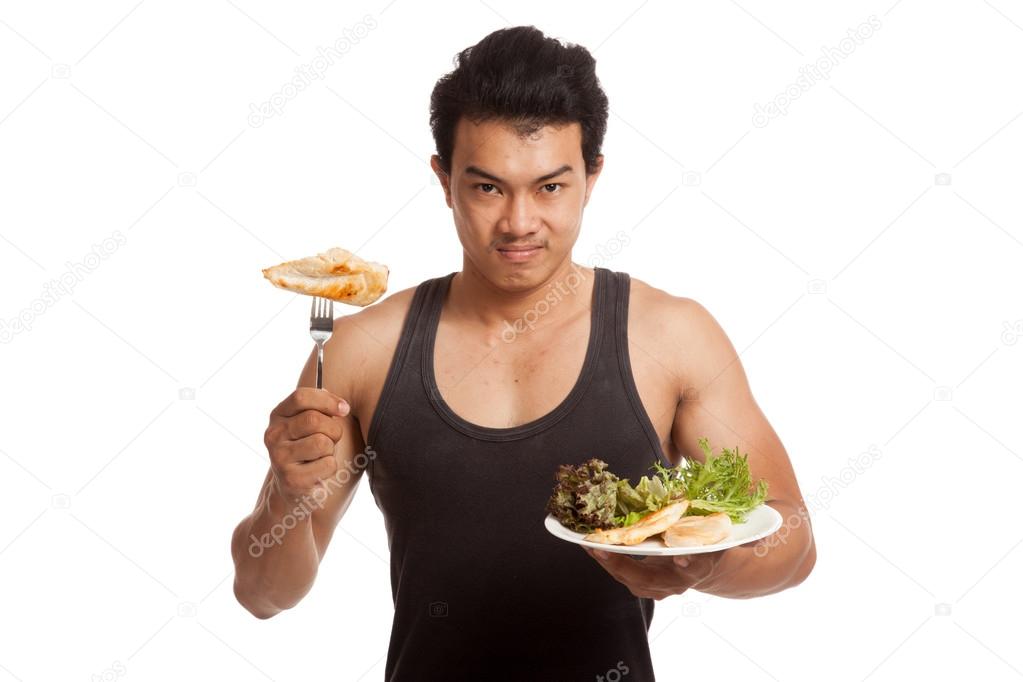 Muscular Asian man eat clean food