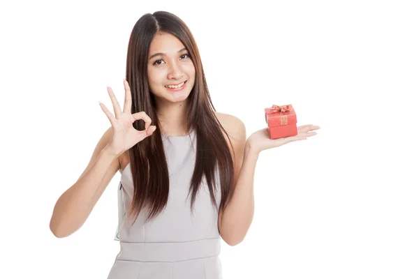 Beautiful young Asian woman with red gift box — Stock Photo, Image