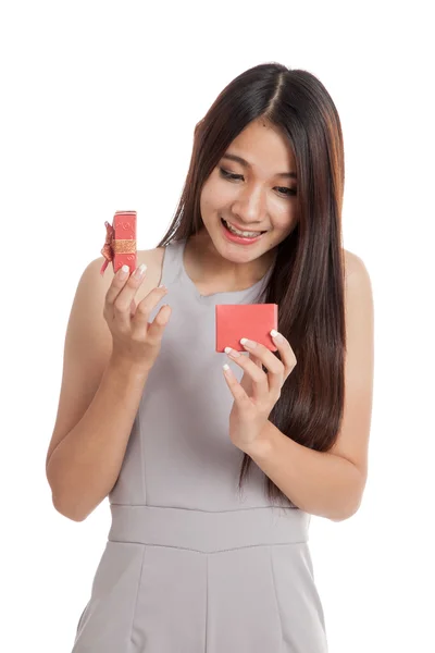 Beautiful young Asian woman with red gift box — Stock Photo, Image