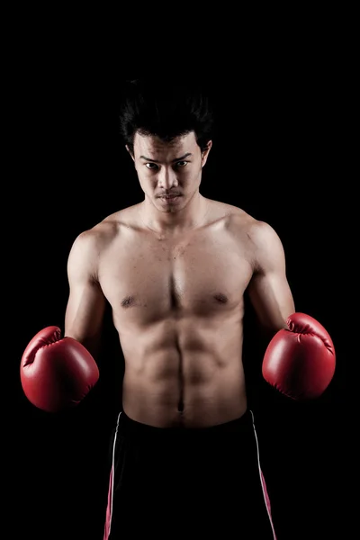 Muscular Asian man with red boxing glove — Stock Photo, Image