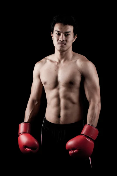 Muscular Asian man with red boxing glove — Stock Photo, Image