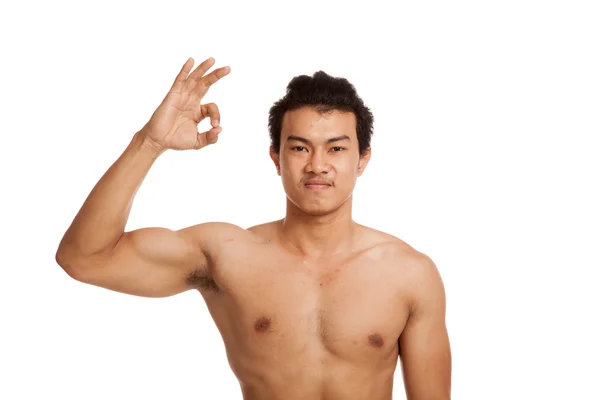 Muskulöse asiatische Mann Biegen Bizeps zeigen ok Zeichen — Stockfoto