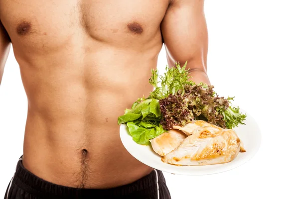 Fuerte muscular asiático hombre con limpia comida — Foto de Stock