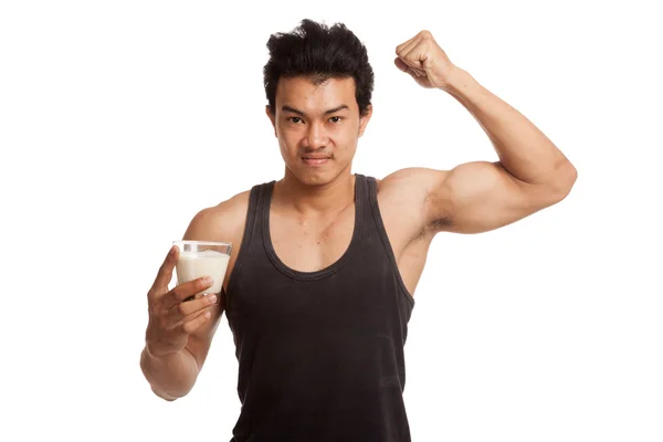 Muscular Asian man flexing biceps with soy milk — Stock Photo, Image