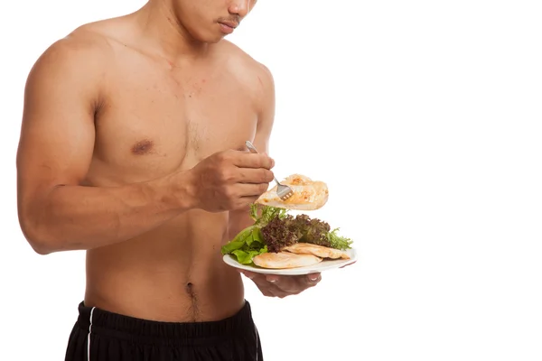 Strong muscular Asian man with clean food — Stock Photo, Image