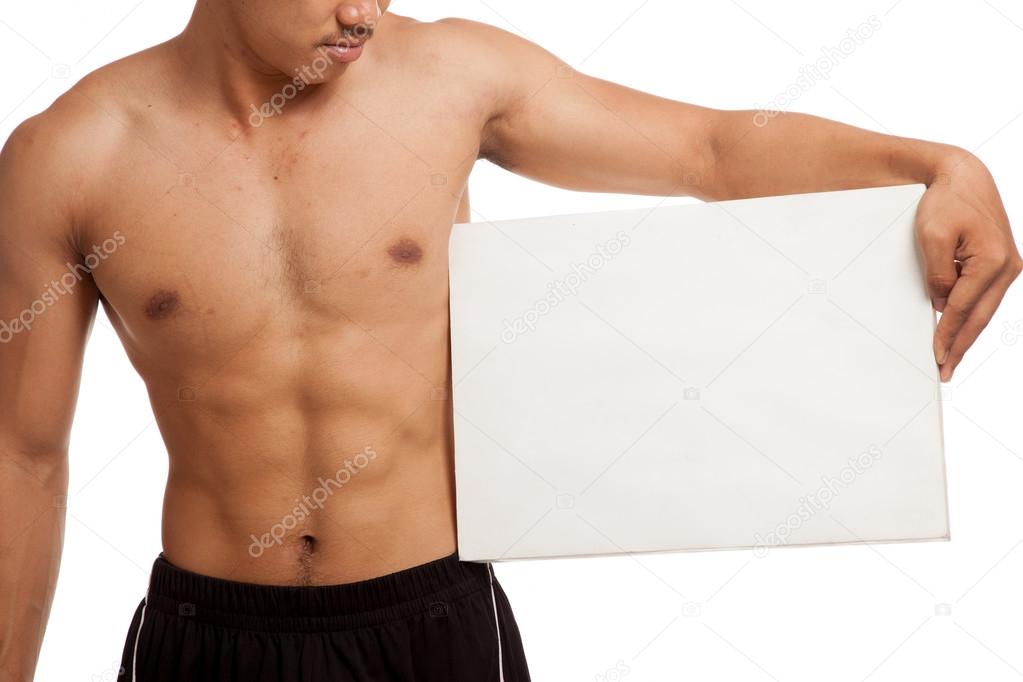Muscular Asian man with blank sign