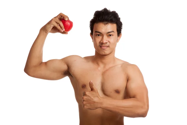 Muscular Asian man thumbs up with red apple — Stock Photo, Image