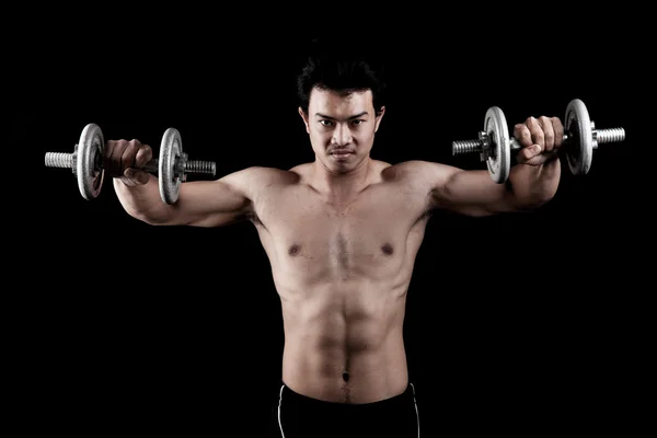 Muscular Asian man with dumbbell — Stock Photo, Image