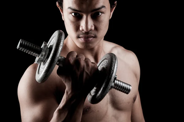 Muscular Asian man with dumbbell — Stock Photo, Image