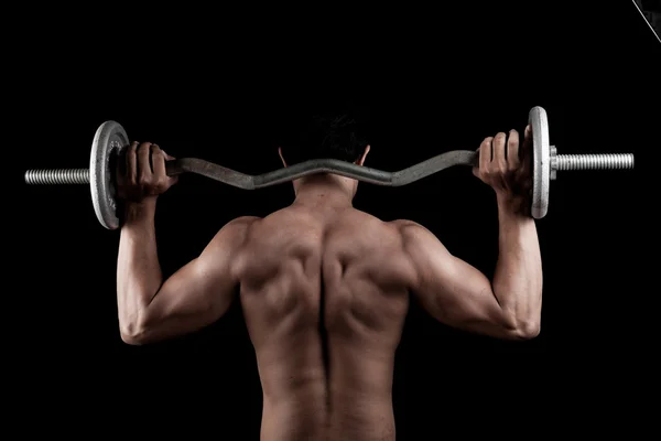 Muscular Asian man with barbell — Stock Photo, Image