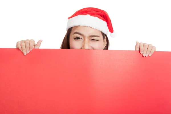 Asian Christmas girl with Santa Claus clothes with blank sign — Stock Photo, Image