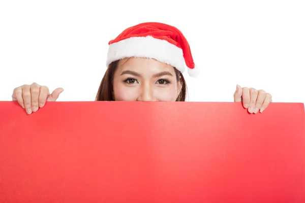 Asiática chica de Navidad con Santa Claus ropa con signo en blanco —  Fotos de Stock