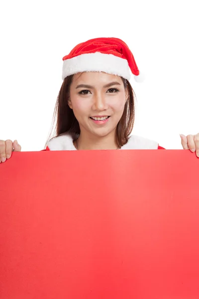 Asiática chica de Navidad con Santa Claus ropa con signo en blanco — Foto de Stock