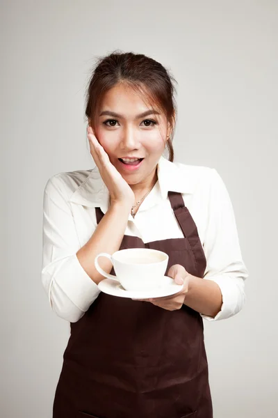 Waitress or barista  in apron  holding coffee — Stock Photo, Image