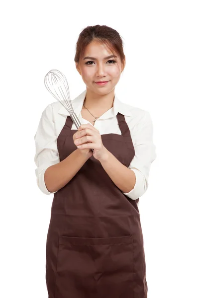 Asian baker girl with whisk — Stock Photo, Image