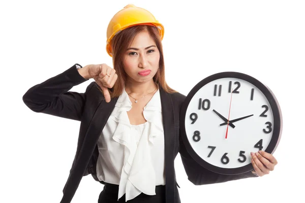 Asiático ingeniero mujer pulgares abajo con un reloj —  Fotos de Stock