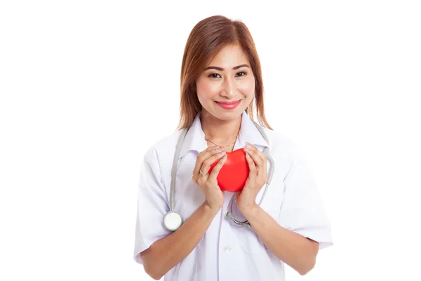 Asian young female doctor hold a red heart — Stock Photo, Image