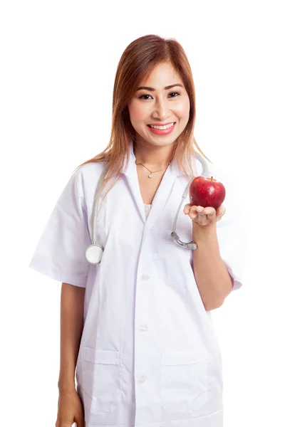 Giovane asiatico femmina medico spettacolo mela — Foto Stock