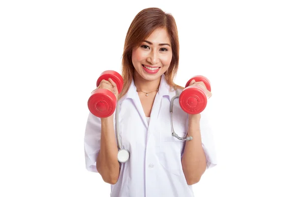 Young Asian female doctor with dumbbells in both hands — Stock Photo, Image