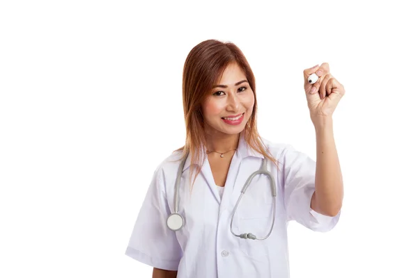 Young Asian female doctor write with a red marker — Stock Photo, Image