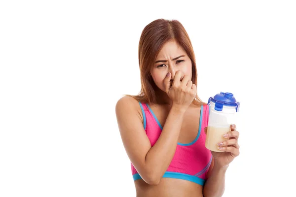 Hermosa chica sana asiática odio suero de leche proteína olor — Foto de Stock