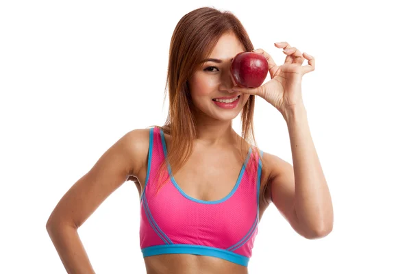 Азиатская здоровая девочка с красным яблоком — стоковое фото
