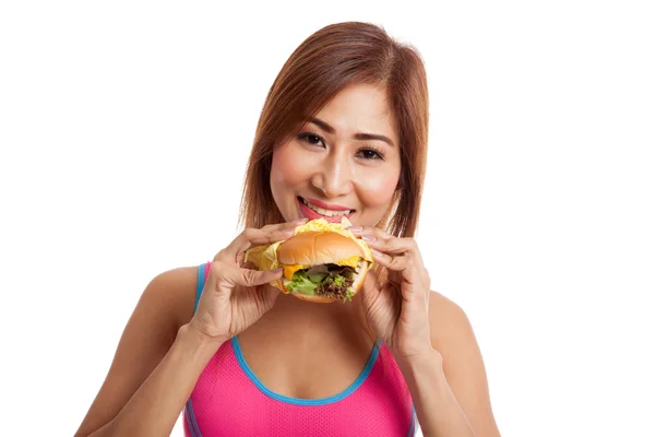 Beautiful Asian healthy girl enjoy eating  hamburger — Stock Photo, Image