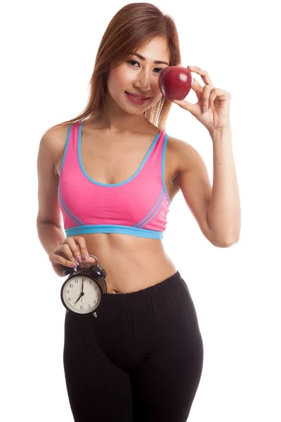 Азиатская здоровая девочка с часами и яблоком — стоковое фото