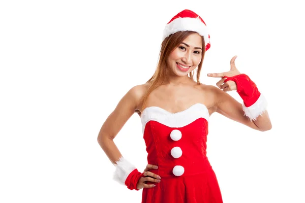 Menina asiática de Natal com roupas de Papai Noel apontar para a esquerda — Fotografia de Stock