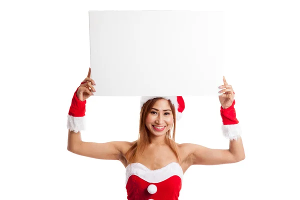 Asijské Vánoce dívka s Santa Claus oblečení s prázdný znak — Stock fotografie