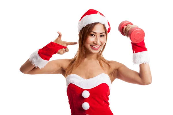 Asian Christmas girl with Santa Claus clothes point to red dumbb — Stock Photo, Image