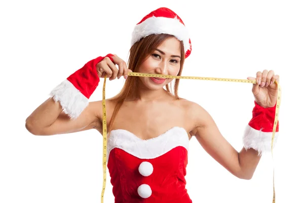 Asiatiska Christmas flicka i Santa Claus kläder kost med mätning — Stockfoto