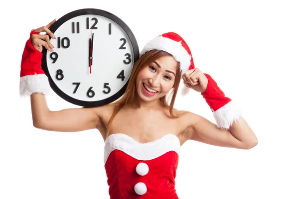 Asiatische Weihnachtsmädchen in Weihnachtsmann Kleidung und Uhr um Mitternacht — Stockfoto