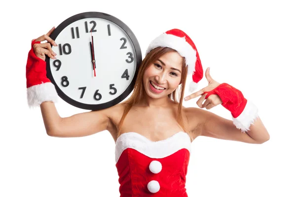 Asiatische Weihnachtsmädchen in Weihnachtsmann Kleidung und Uhr um Mitternacht — Stockfoto