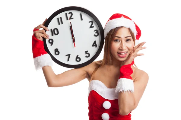 Asian Christmas girl in Santa Claus clothes and clock at midnigh — Stock Photo, Image