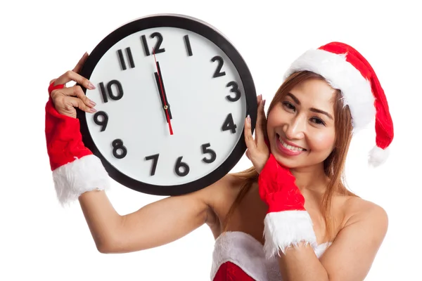 Asian Christmas girl in Santa Claus clothes and clock at midnigh — Stock Photo, Image