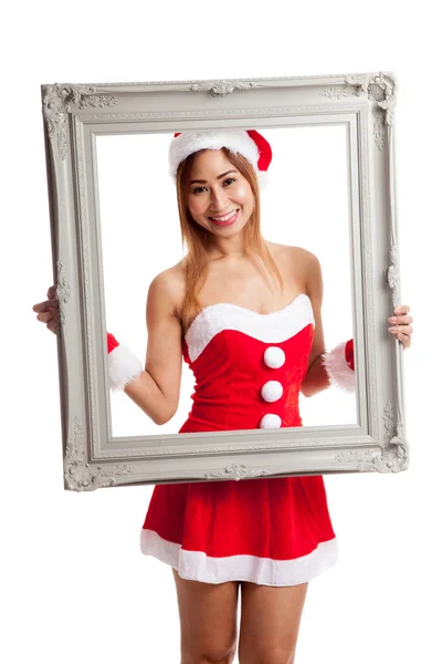 Asiatische Weihnachtsmädchen mit Weihnachtsmann Kleidung und Rahmen — Stockfoto