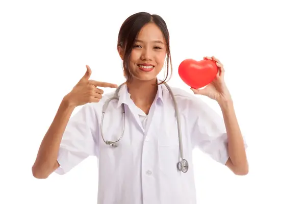 Young Asian female doctor point to red heart — Stock Photo, Image