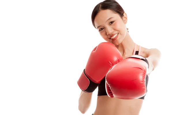Beautiful healthy Asian girl with red boxing glove — Stock Photo, Image