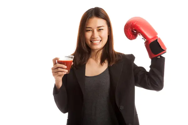 Young Asian business woman with tomato juice and boxing glove. — Stock Photo, Image