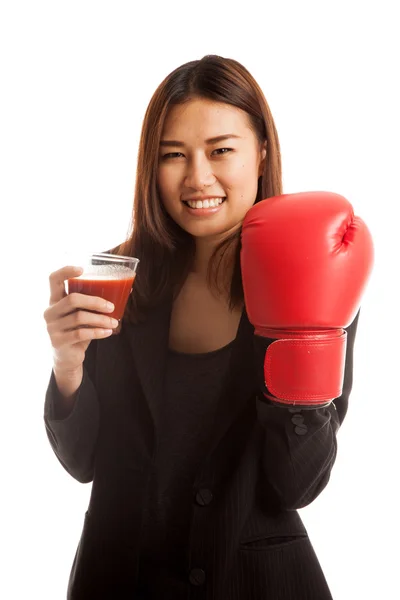 Young Asian business woman with tomato juice and boxing glove. — Stock Photo, Image